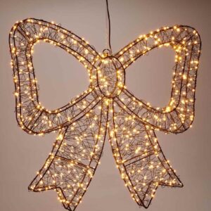 Verlichte kerststrik van 38 cm met extra warmwitte leds aan een donkere wand